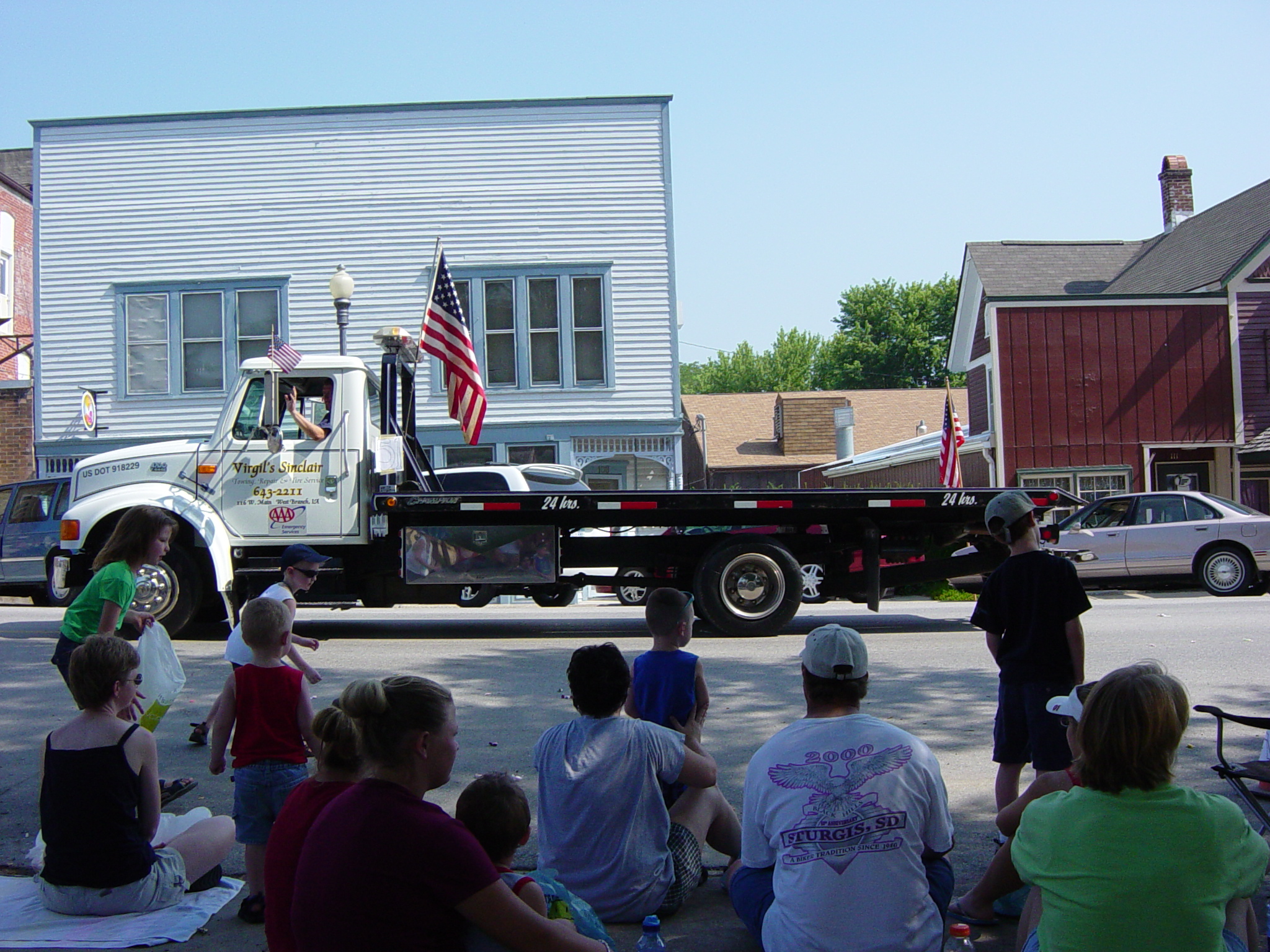 Another flatbed tow truck.